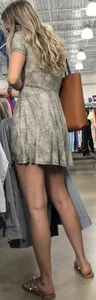 Basic blonde in a dress shopping for her man
