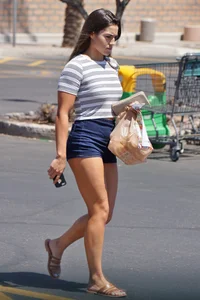 Hot brunette with a great ass in tight denim shorts