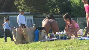 Sexy Latino milf in a thong bikini working out at the park