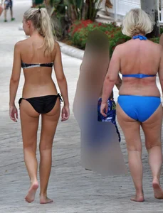 Sexy blonde bikini girl walking with mom