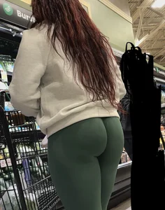 Ebony with a DEEP WEDGIE  in Green Leggings
