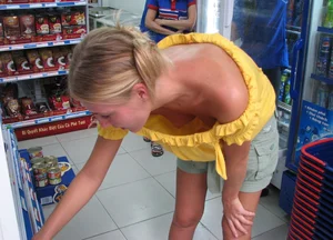 Candid Girl With a Small Breast Flashing Her Tits While Bending Over at the Store Creepshot