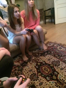 Cute Teen Gamer Girl in a Short Dress And Pantyhose With No Shoes On