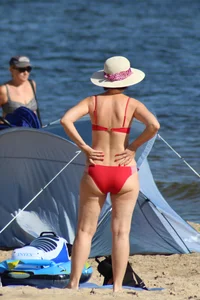 Couple of hot babes hanging out at the beach in bikinis