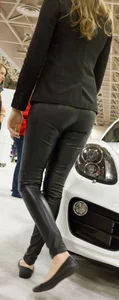 Pretty car saleswoman in tight shiny black pants with nice ass