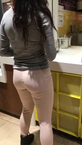 Sexy brunette in pink leggings getting food with a great ass and beautiful face