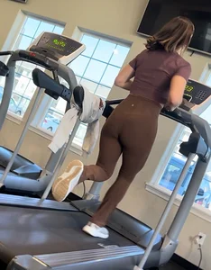 Brown Lululemon flares running on treadmill