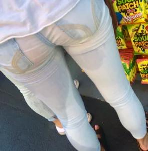Girl in wet jeans making them semi see through