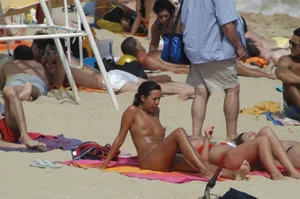 Topless girls on a beach in Barcelona