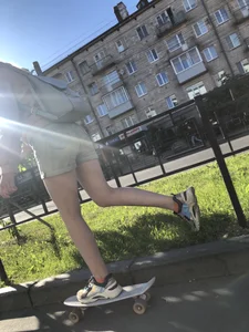 Girl in Denim Shorts on Skateboard Street Candid Photos