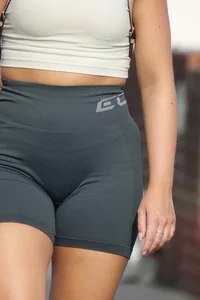 Blonde woman in lycra shorts - good front view, back view ruined by a bag