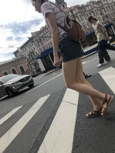 Young Girl in Shorts And Sandals Crossing the Street Gallery