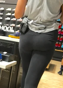 Shoe store employee with a sexy bubble butt in leggings
