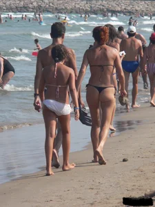 Bunch of sexy babes at the beach in thong bikinis