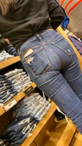 Teen in tight jeans looks to buy another pair
