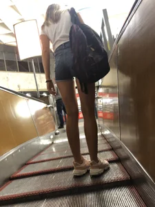 Girl in Mini Shorts with Awesome Legs on the Subway Escalator Creepshots