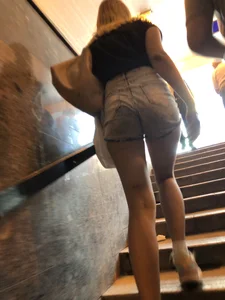Teen in Denim Shorts Walking up the Stairs Closeup Creepshots