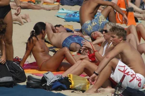 Topless girls on a beach in Barcelona