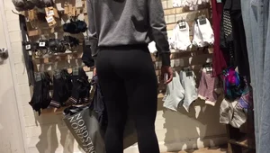 Girl with pigtails and an incredible ass in tight leggings shopping