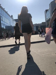 Candid teen in shorts with nice legs and booty street pics