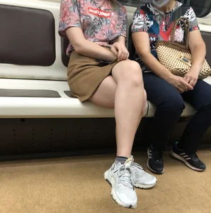 Amazing Hot Girl in a Skirt and Sneakers Sitting Cross-Legged in the Subway Train and on the Escalator Candid Photos Gallery