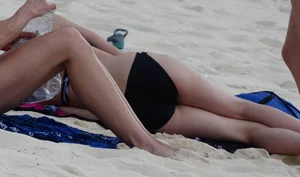 Two candid skinny teen sisters in bikinis