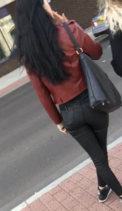 Chav brunette with a nice ass and vpl in tight black leather pants