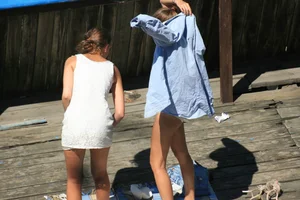 Two teens stripping and going topless to tan