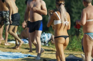Hot Young Milf in Swimsuit Walking on Sand Beach Photos