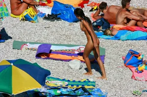 Ula FKK Sexy brunette on a nude beach topless, bottomless and with blue thong