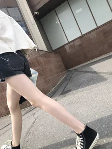 Cute candid teen with pale slim legs in shorts