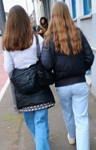 Two cute girls in jeans street creepshot