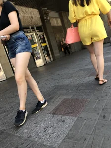 Cute Girl Distributing Leaflets in Shorts City Candid Gallery