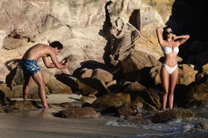 Iris Mittenaere in a white thong bikini on the beach in St Martin