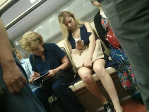Blonde with Pale Skin and Hot Legs Sitting in Subway Train