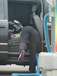 Girls cleaning their cars in jeans and pants
