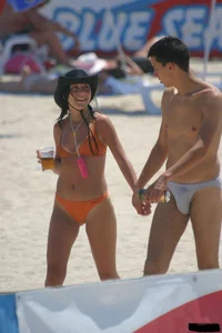 A bunch of sexy beach voyeur babes in bikinis, thongs and topless