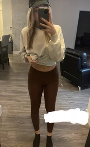 Girl in tights showing her tummy mirror selfie