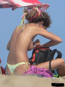 Sexy girls going topless at the beach showing off their sexy bodies
