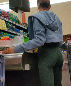Insanely hot brunette shopping in tight green leggings