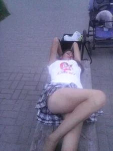 Girl in Skirt Lying on the Bench Street Creepshot