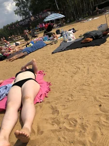 Hot Girls in Swimsuits Lying on a Beach Gallery