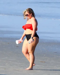 Thick BBW blonde lady in a bikini at the beach