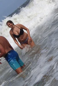 Thick beach girl with massive boobs