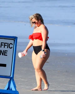 Thick BBW blonde lady in a bikini at the beach