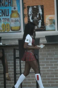 Sexy ebony Tilted Kilt employee in her uniform