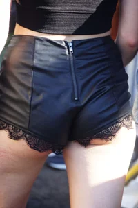 Girl showing some cheeks with a nice ass in pleather shorts