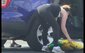 Redhead milf with a nice ass and vtl in leggings while loading her car
