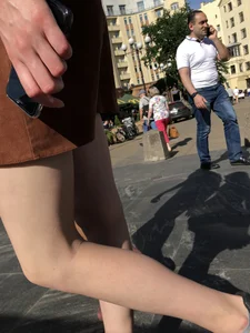 Hot pale legs closeup on the street