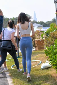 Hula hooping skinny Asian in light blue leggings with vpl